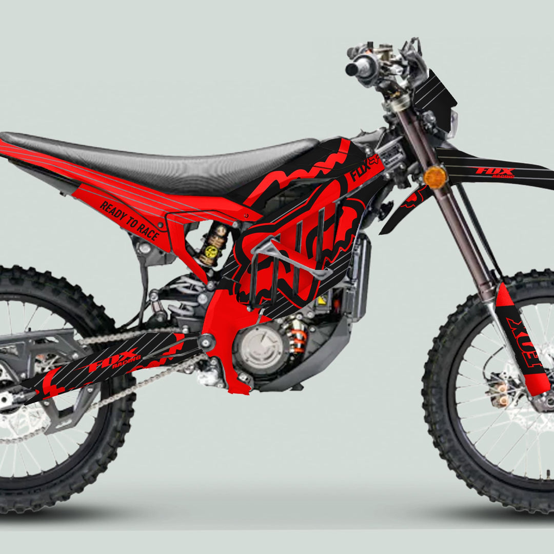Surron Ultra Bee Graphics Kit FOX STRIPES Black Red on motocross bike, showcasing sleek black and red design with FOX RACING logos and READY TO RACE slogan.