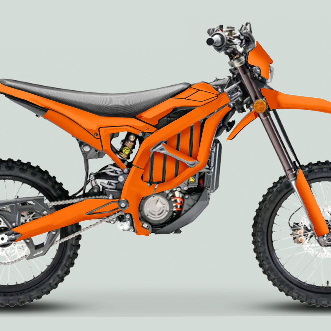 Side-profile of a Surron Ultra Bee motorcycle, showcasing the Solid Color Orange graphics kit with durable, weather-resistant decals for an enhanced, personalized aesthetic.