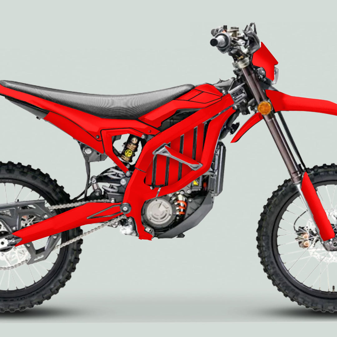 Surron Ultra Bee Graphics Kit SOLID COLOR RED on a red dirt bike, featuring sturdy decals, knobby tires, and advanced suspension for enhanced off-road aesthetics and protection.