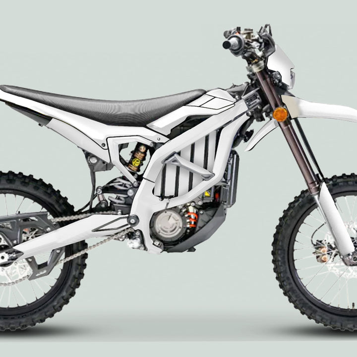 Surron Ultra Bee Graphics Kit SOLID COLOR WHITE on an electric dirt bike, highlighting its knobby tires, tubular frame, and sleek design for enhanced style and protection.