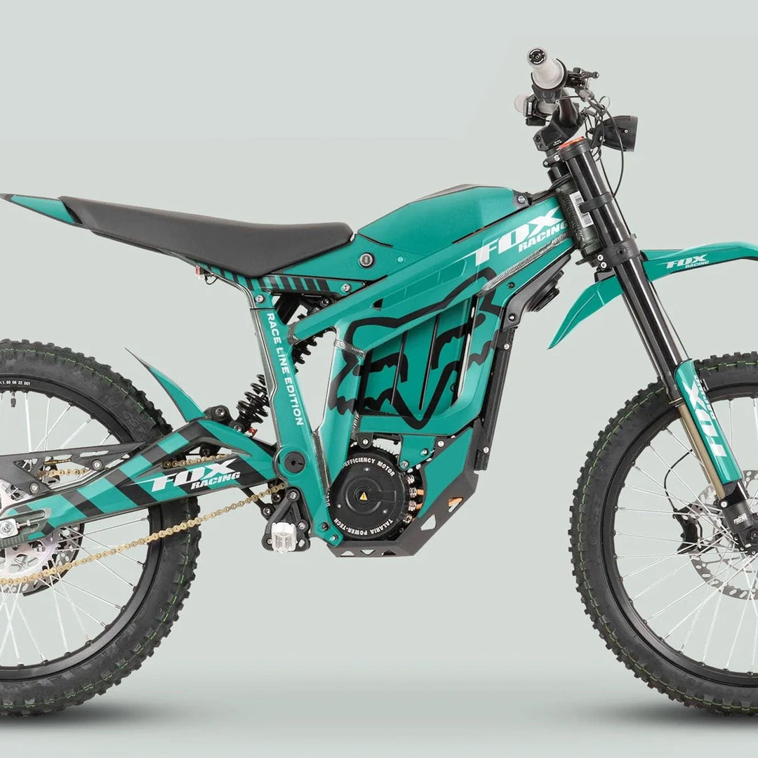 Talaria Sting MX3 MX4 Graphics Kit on teal electric dirt bike, featuring FOX Raceline design with coil-spring rear shock and high-efficiency motor.