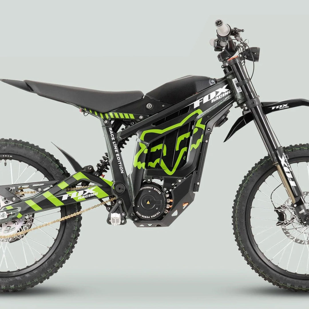 Talaria Sting MX3 MX4 Graphics Kit FOX Raceline Black Green on an electric dirt bike with high-tensile frame, coil shock, knobby tires, and disc brakes.