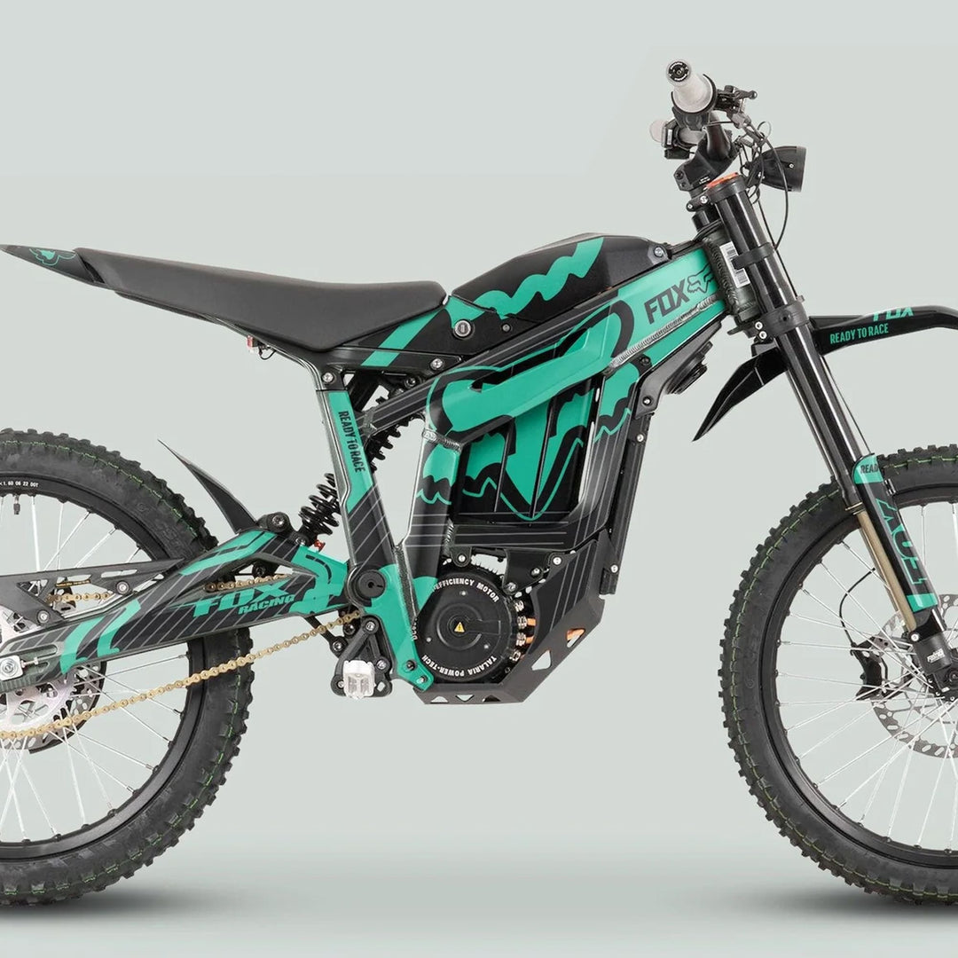 Talaria Sting MX3 MX4 Graphics Kit FOX STRIPES Black Mint on an electric off-road motorcycle, showcasing black-teal design, knobby tires, and Ready to Race branding.
