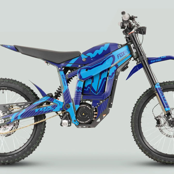 Talaria Sting MX3 MX4 Graphics Kit FOX STRIPES Navy Cyan on blue-black electric dirt bike, showcasing tubular frame, suspension, spoked wheels, and vibrant decals.