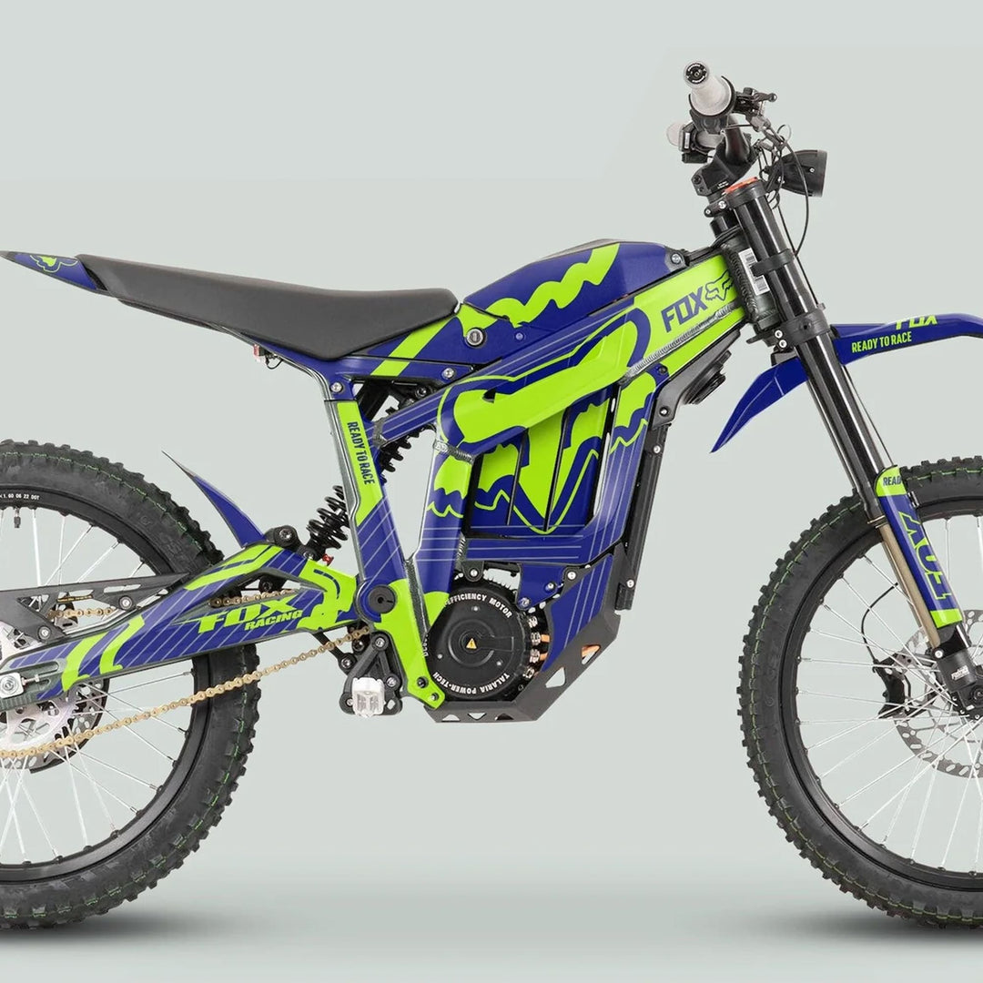 Side-view of Talaria Sting MX3 MX4 Graphics Kit FOX STRIPES Navy Green on dirt bike, showcasing knobby tires, electric motor, suspension, and motocross-style seat.