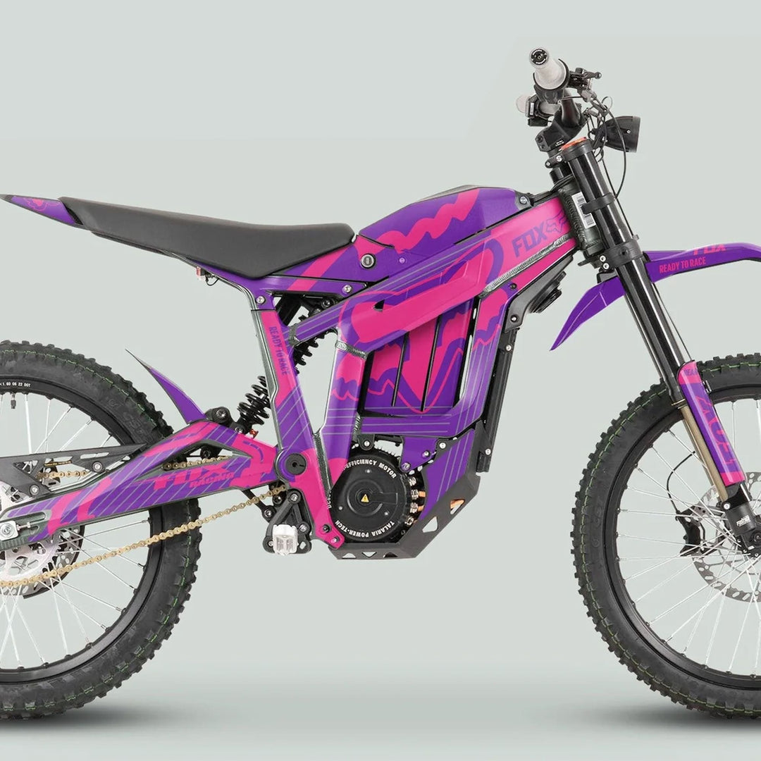 Talaria Sting MX3 MX4 Graphics Kit FOX STRIPES Purple Magenta on an e-dirt bike with knobby tires, telescopic forks, coil spring shock, and disc brakes.