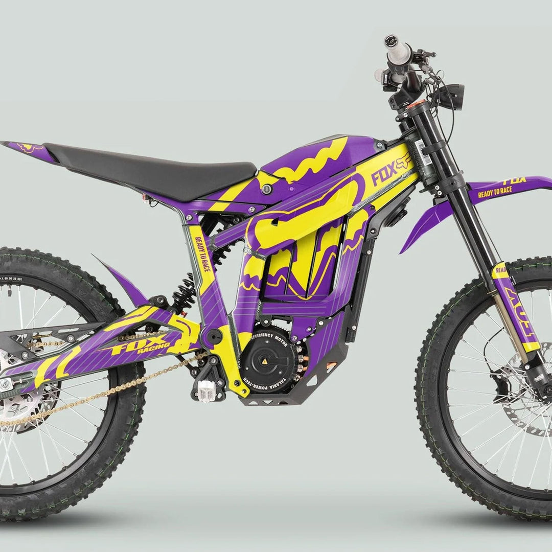 Side-profile of Talaria Sting MX3 MX4 with FOX STRIPES Purple Yellow graphics kit, showcasing vibrant, durable decals on an electric dirt bike.