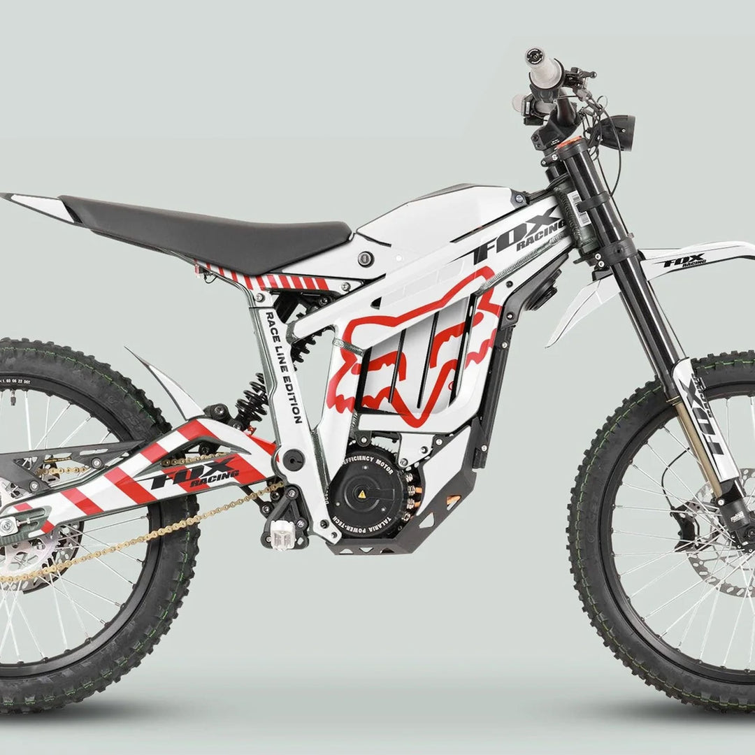 Side-view of a Talaria Sting bike with the MX3 MX4 Graphics Kit FOX Raceline White Red, featuring red graphics on a white frame, designed for durability.