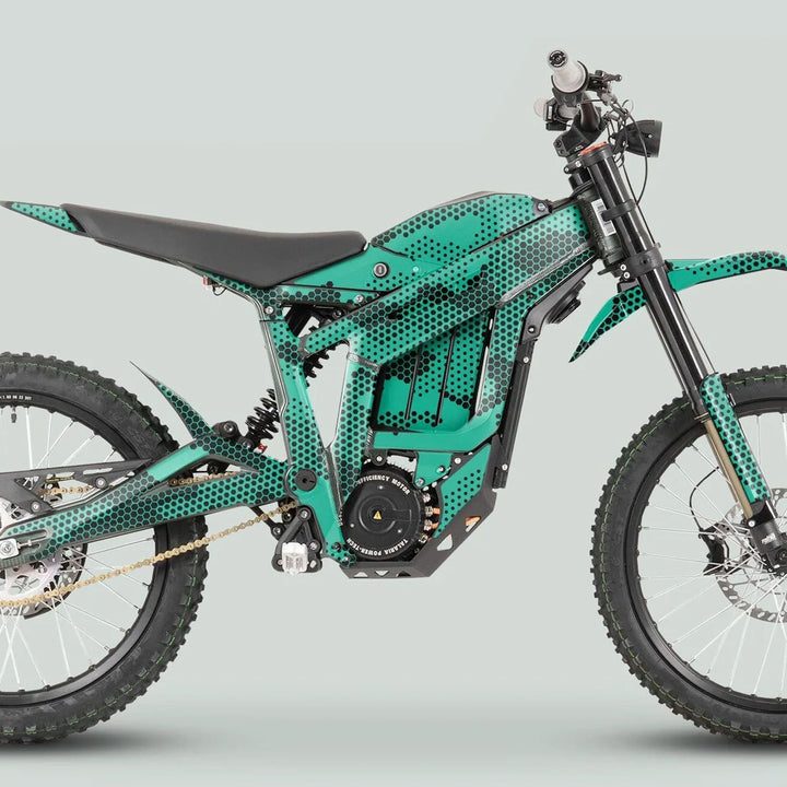Talaria Sting MX3 MX4 Graphics Kit HEXOCAM Mint on an electric off-road motorcycle, showcasing teal/black hexagon-dot livery and minimalist bodywork with knobby tires and long-travel suspension.