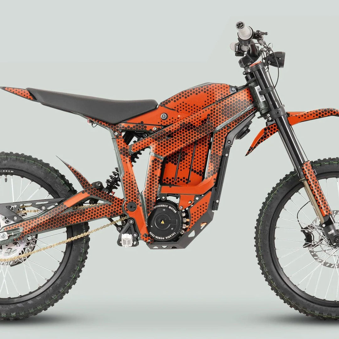 Side profile of Talaria Sting MX3 MX4 Graphics Kit HEXOCAM Orange on full-suspension electric bike, showcasing vibrant decals and sleek off-road design features.
