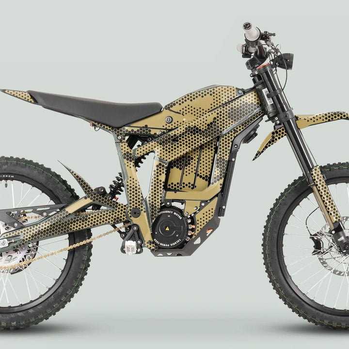 Talaria Sting MX3 MX4 Graphics Kit HEXOCAM Sand on an e-mountain bike with front suspension, electric motor, and knobby tires, showcasing distinctive black-and-gold design.