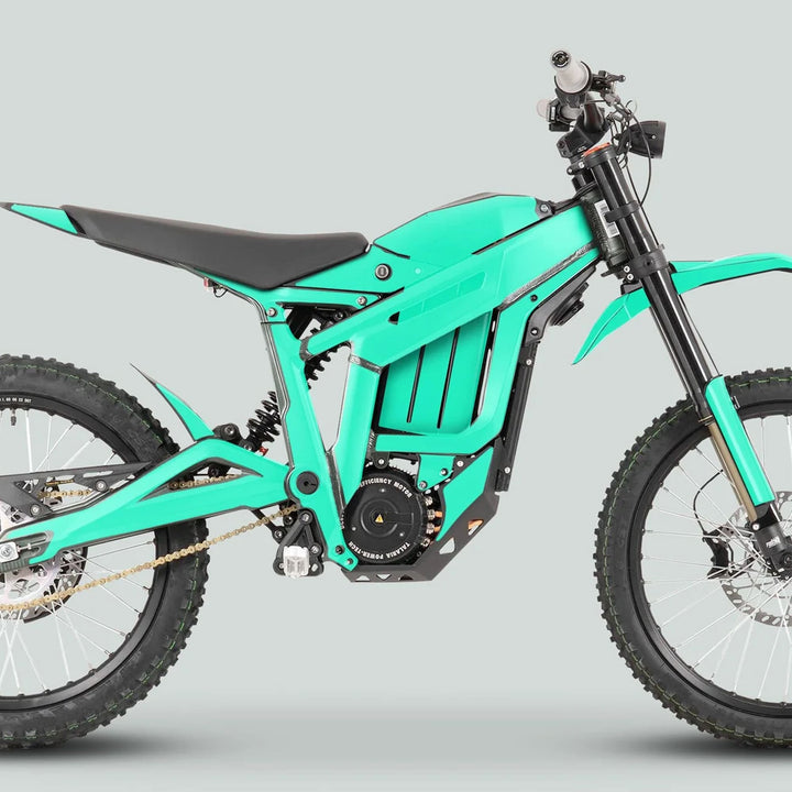 Talaria Sting MX3 MX4 Graphics Kit SOLID COLOR MINT on a teal electric dirt bike, showcasing its tubular frame, knobby tires, and streamlined design.