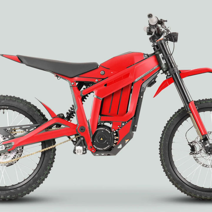 Side profile of a red electric off-road motorcycle featuring the Talaria Sting MX3 MX4 Graphics Kit SOLID COLOR RED, showcasing durable, easy-to-apply decals tailored for a custom fit.