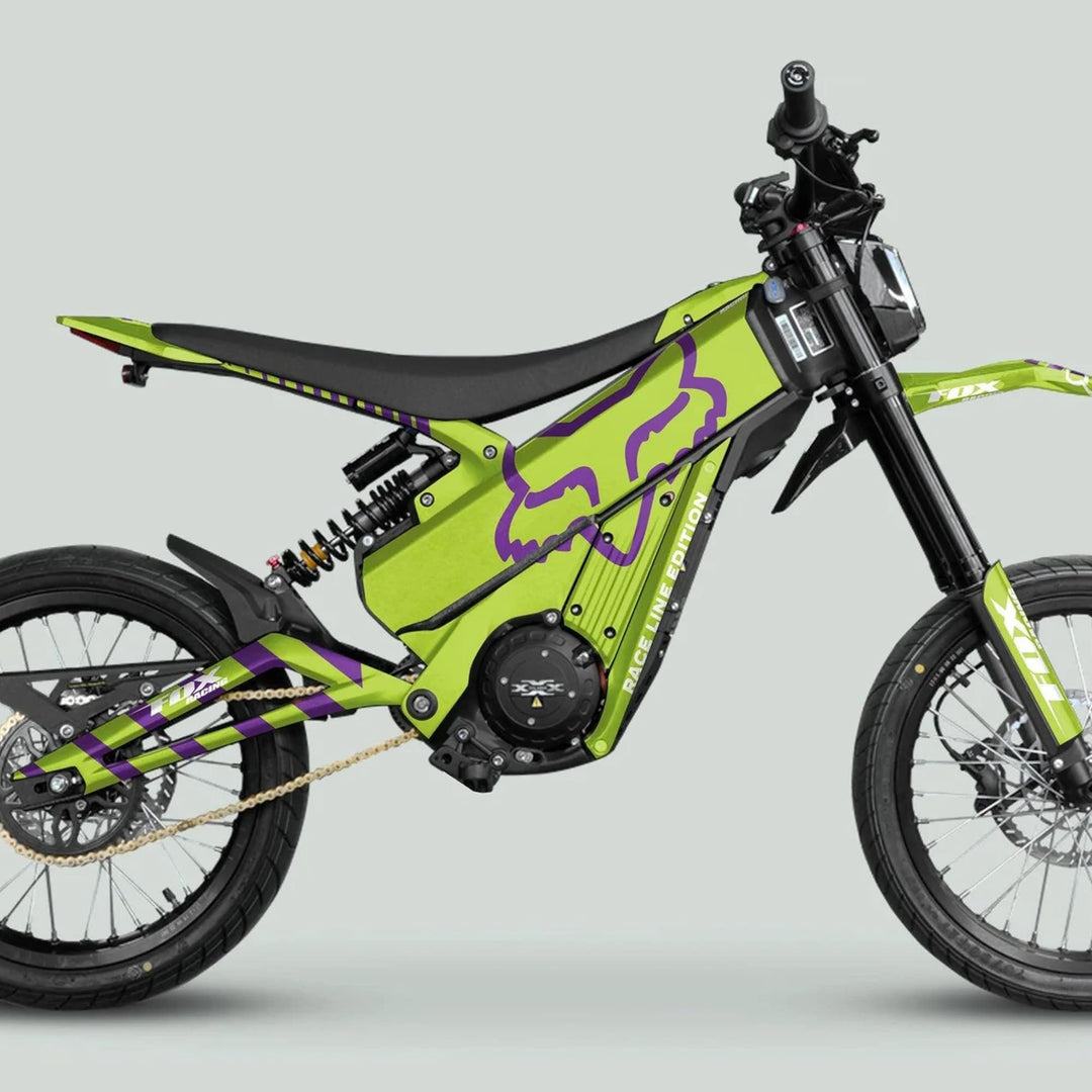 Talaria XXX Graphics Kit FOX RACELINE Green Purple on electric dirt bike, showcasing vibrant decals, tubular frame, gold chain, and sleek design features.