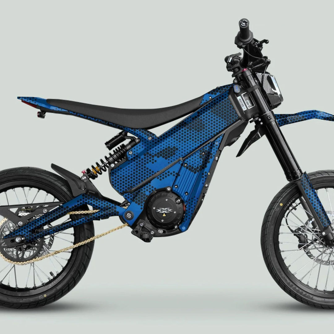 Talaria XXX Graphics Kit HEXOCAM Blue on an electric dirt bike, featuring a hex-dot camo pattern on blue panels, enhancing style and protection.