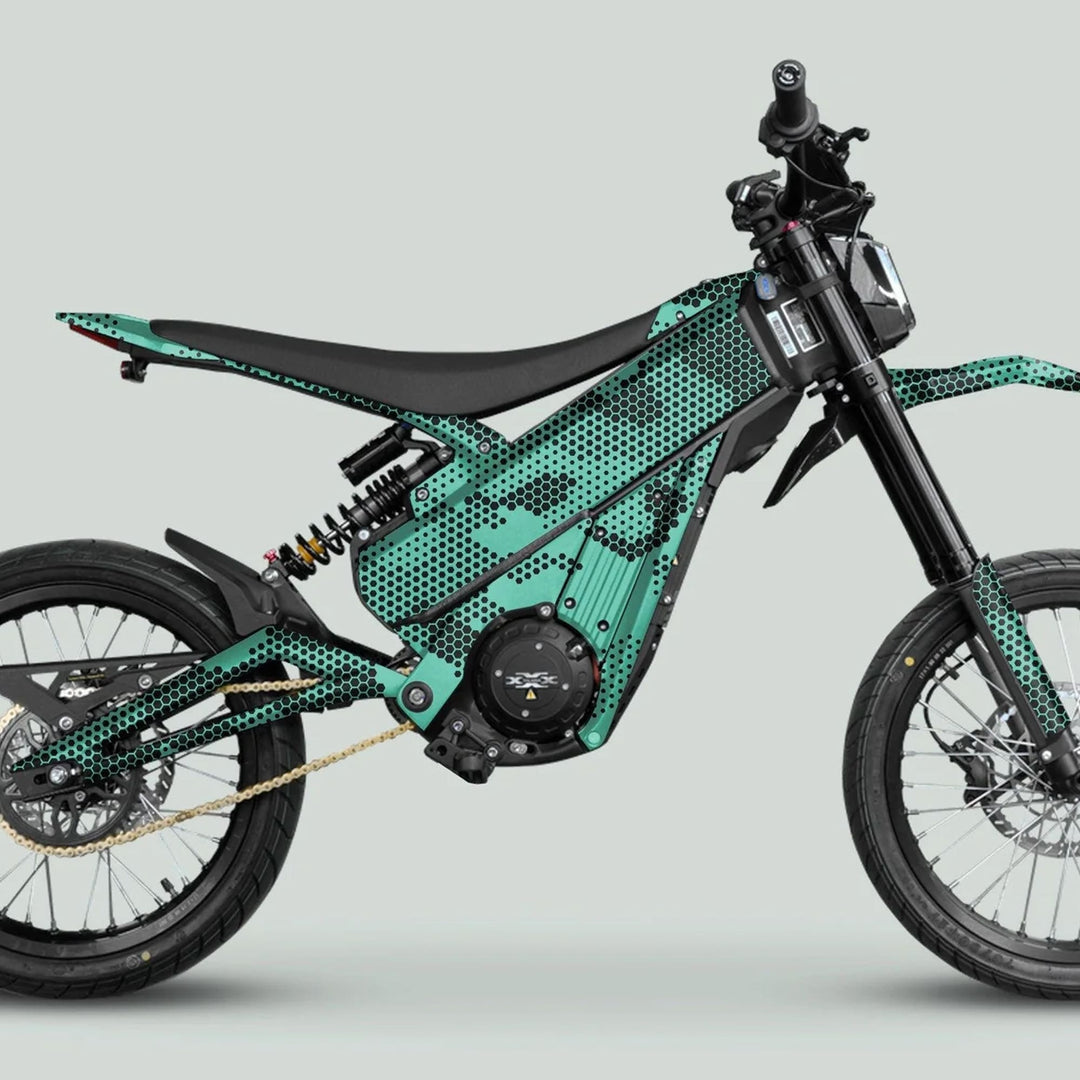 Talaria XXX Graphics Kit HEXOCAM Mint enhances an electric dirt bike's sleek design with teal-and-black honeycomb graphics, ensuring durability and standout style on trails.